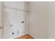 A laundry room with utility connections and a wire rack shelf at 8970 Ruel Ln, Suwanee, GA 30024