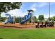 Community playground offers slides, climbing structures, and seating for residents to enjoy at 8970 Ruel Ln, Suwanee, GA 30024