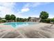 Beautiful community pool area with a bath house, lounge chairs and mature trees at 8970 Ruel Ln, Suwanee, GA 30024