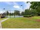 Well-maintained community tennis courts surrounded by greenery for an active lifestyle at 8970 Ruel Ln, Suwanee, GA 30024