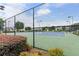 Community tennis courts surrounded by lush landscaping provide a welcoming atmosphere at 8970 Ruel Ln, Suwanee, GA 30024