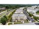 Aerial view of luxury townhome community with lush landscaping and convenient access to major roadways at 132 Grand Cres, Alpharetta, GA 30009