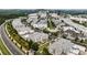 Expansive aerial view of an upscale townhome community near shopping, dining, and commercial areas at 132 Grand Cres, Alpharetta, GA 30009