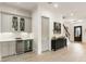 Bar area with gray cabinetry, beverage refrigerator and storage space for drinks and snacks at 132 Grand Cres, Alpharetta, GA 30009