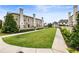 Exterior showcasing the manicured green space between townhomes, offering a serene and inviting community atmosphere at 132 Grand Cres, Alpharetta, GA 30009