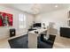 Modern home office featuring a sleek white desk, contemporary lighting, and minimalist decor at 132 Grand Cres, Alpharetta, GA 30009