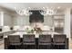 An open kitchen features an island with counter seating and stainless steel appliances at 132 Grand Cres, Alpharetta, GA 30009