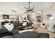 Spacious living room with a modern chandelier, kitchen view, and stairs to the second floor at 132 Grand Cres, Alpharetta, GA 30009