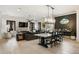 Bright open floor plan featuring a living area, dining table, and modern lighting at 132 Grand Cres, Alpharetta, GA 30009