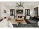 Stylish living room with modern lighting, a fireplace, and comfortable seating arrangement at 132 Grand Cres, Alpharetta, GA 30009