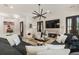 Open-concept living area with modern decor, a fireplace, and comfortable seating at 132 Grand Cres, Alpharetta, GA 30009