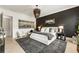 Spacious main bedroom features a modern color palette, contemporary lighting, and ample natural light at 132 Grand Cres, Alpharetta, GA 30009