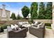 Outdoor patio with cushioned seating, landscape, and beautiful views of the surrounding manicured green spaces at 132 Grand Cres, Alpharetta, GA 30009