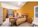 Bright bedroom featuring high ceilings, a ceiling fan, and a large window with natural light at 4200 Vinca Way, Union City, GA 30291