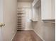 Walk-in closet with carpet floors and built-in shelving for optimal organization at 4200 Vinca Way, Union City, GA 30291