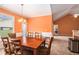 Bright dining room with vaulted ceilings and view of the backyard and kitchen at 4200 Vinca Way, Union City, GA 30291