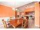 Open concept dining room with view of fireplace, kitchen and adjacent living spaces at 4200 Vinca Way, Union City, GA 30291