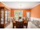 Well-lit dining room featuring a china cabinet and outdoor view from the window at 4200 Vinca Way, Union City, GA 30291