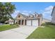 Charming home featuring a two-car garage, dormer windows and professionally landscaped yard at 4200 Vinca Way, Union City, GA 30291