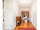 Inviting hallway with hardwood floors and decorative trim, leading to an open living space at 4200 Vinca Way, Union City, GA 30291