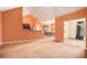Open-concept living room with carpeted floor and views of the dining area and kitchen at 4200 Vinca Way, Union City, GA 30291