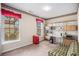 Cozy office with ample shelving, natural light, and a comfortable sofa at 4200 Vinca Way, Union City, GA 30291