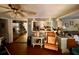 Open concept living area with wood floors connecting the living room to the kitchen at 3617 Bob White Ln, Loganville, GA 30052