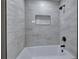 Bathroom featuring shower and bathtub combo with decorative tile and bronze fixtures at 380 Inman Rd, Fayetteville, GA 30215