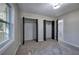 Bedroom featuring multiple closets, neutral paint and new windows that provide natural light at 380 Inman Rd, Fayetteville, GA 30215
