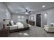Serene bedroom with plush carpet, a ceiling fan, and a large window at 380 Inman Rd, Fayetteville, GA 30215