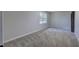 Cozy bedroom with neutral carpet and a bright window, creating a serene atmosphere at 380 Inman Rd, Fayetteville, GA 30215