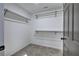 Walk-in closet features white walls, carpet flooring, and metal hanging rods at 380 Inman Rd, Fayetteville, GA 30215