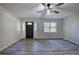 Inviting entryway featuring hardwood floors, white walls, and ample natural light at 380 Inman Rd, Fayetteville, GA 30215