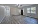 Open concept living area with hardwood floors leading to front door at 380 Inman Rd, Fayetteville, GA 30215