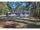 Charming, newly renovated single-story home featuring a white brick facade and a lush front yard at 380 Inman Rd, Fayetteville, GA 30215