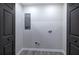 Laundry room features wood-look flooring and washer/dryer hookups at 380 Inman Rd, Fayetteville, GA 30215