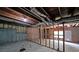 Unfinished basement featuring exposed ductwork, wood framing, and concrete foundation walls at 405 Rosedown Way, Lawrenceville, GA 30043