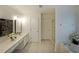 Bright bathroom featuring a vanity, separate shower, garden tub, and decorative accents at 405 Rosedown Way, Lawrenceville, GA 30043