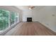 Spacious living room with hardwood floors, large windows, and a classic fireplace design at 405 Rosedown Way, Lawrenceville, GA 30043