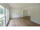 Bright and airy living room with large windows providing natural light and hardwood flooring at 405 Rosedown Way, Lawrenceville, GA 30043