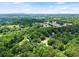 Sprawling community aerial view showcasing the tree coverage, sidewalks and homesites, creating a beautiful landscape at 5885 Millstone Dr, Cumming, GA 30028