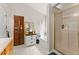 Elegant bathroom with a bathtub, glass shower, and modern fixtures, ideal for relaxation at 5885 Millstone Dr, Cumming, GA 30028