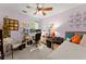 Versatile bedroom featuring desk setup and bed, perfect for a home office at 5885 Millstone Dr, Cumming, GA 30028