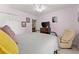 Charming bedroom with lilac walls, plush carpet, and Queen-sized bed near a TV at 5885 Millstone Dr, Cumming, GA 30028
