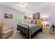 Comfortable bedroom with large window, soft carpet, and Queen-sized bed at 5885 Millstone Dr, Cumming, GA 30028