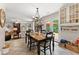 Inviting dining area with an open concept design and bright natural light from an adjacent outdoor deck at 5885 Millstone Dr, Cumming, GA 30028
