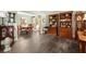 Spacious living room with hardwood floors, elegant furnishings, and seamless flow to the dining area at 5885 Millstone Dr, Cumming, GA 30028