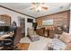 Functional home office with a desk, storage, and a comfortable seating area for relaxation at 5885 Millstone Dr, Cumming, GA 30028