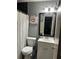 This bathroom boasts new fixtures, updated vanity, and decorative floral artwork at 6658 Ramsgate Way, Norcross, GA 30093