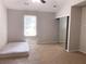 Bright bedroom with a closet, ceiling fan, and natural light at 6658 Ramsgate Way, Norcross, GA 30093